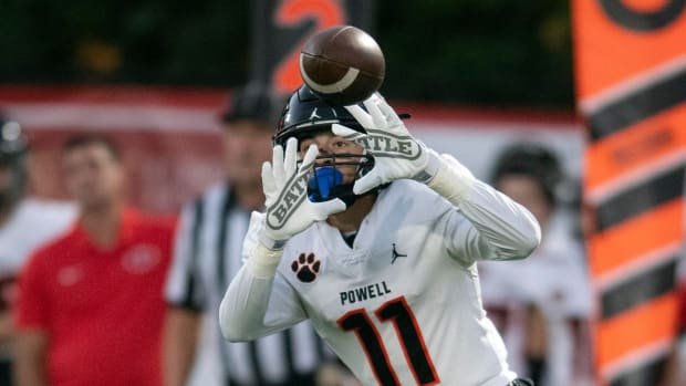 Ayden Greene catching a pass for Powell High School.